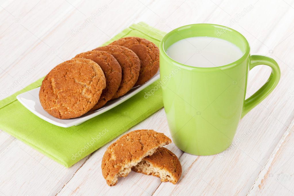 Cup of milk and gingerbread cookies