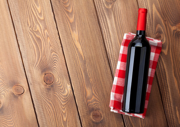 Red wine bottle over towel