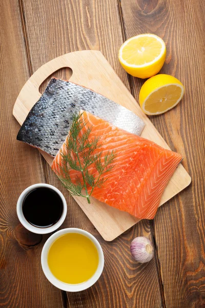 Salmon, spices and condiments — Stock Photo, Image