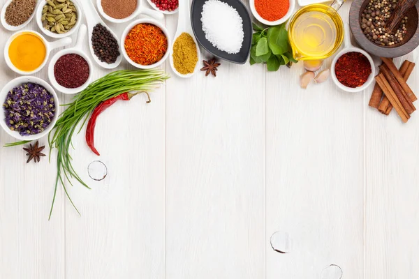 Various spices on white wooden background — Stock Photo, Image