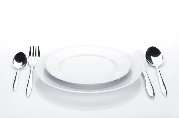 Silverware or flatware set and plates — Stock Photo, Image