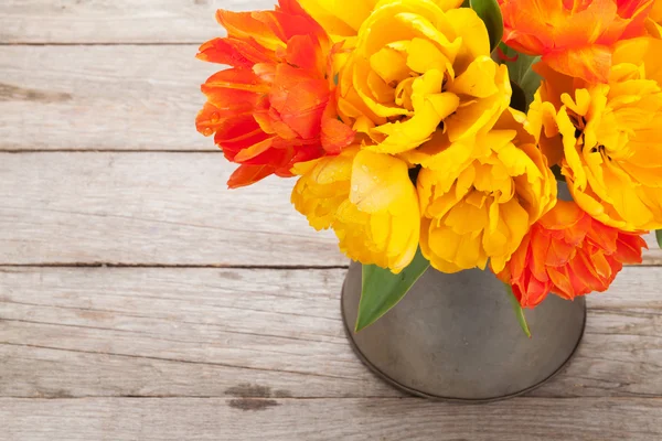 Colorful tulips bouquet in watering can — Stock Photo, Image