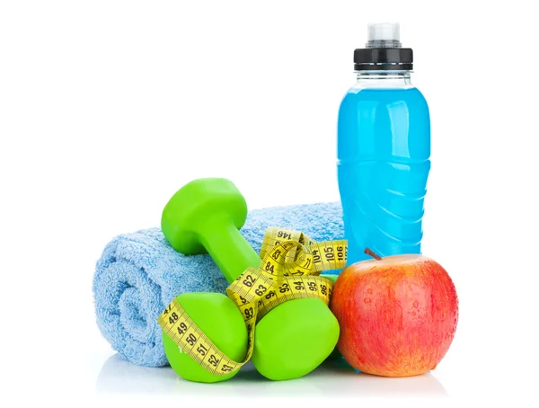 Groene dumbells, lintmeter en fles — Stockfoto