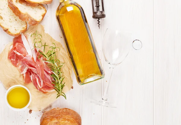 Prosciutto, wine, ciabatta, parmesan and oil — Stock Photo, Image