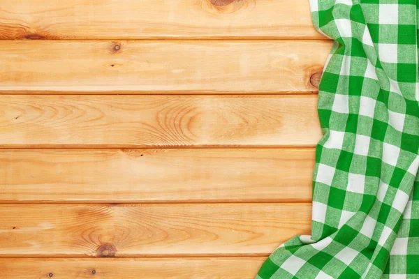 Na stole w kuchni drewniane zielony ręcznik — Zdjęcie stockowe