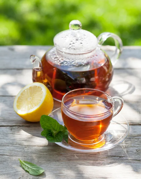 Breakfast tea on table in garden — Stock Photo, Image