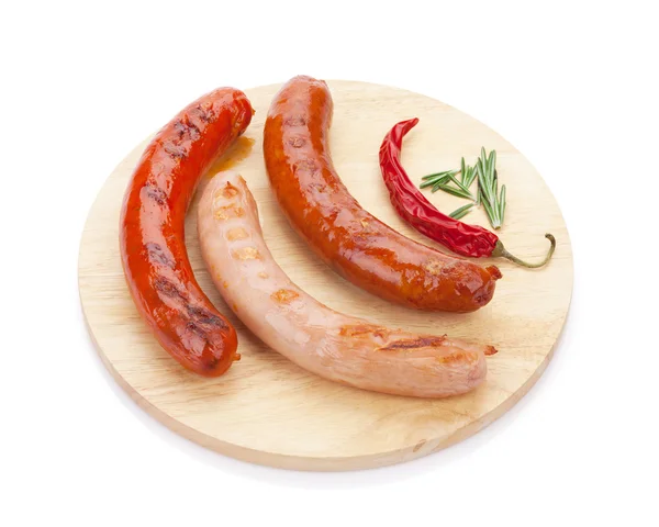 Various grilled sausages with spices — Stock Photo, Image