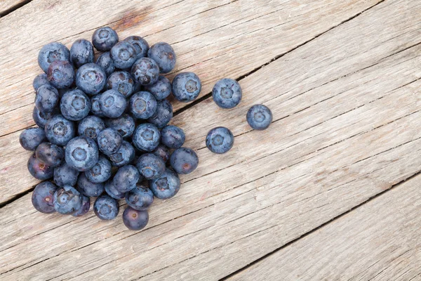 Blueberries on wooden table — Stock Photo, Image