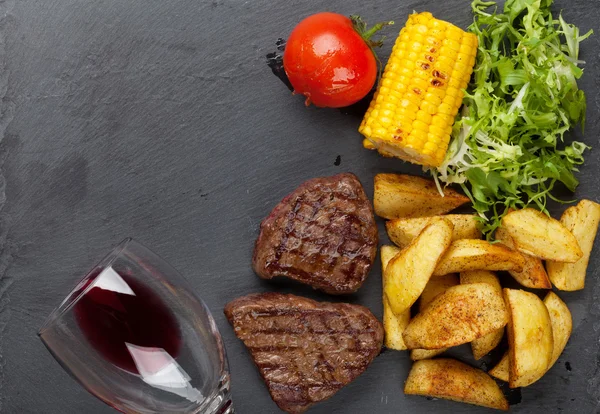 Beef steaks with grilled potato — Stock Photo, Image