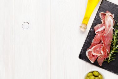 Prosciutto with rosemary and olive oil clipart