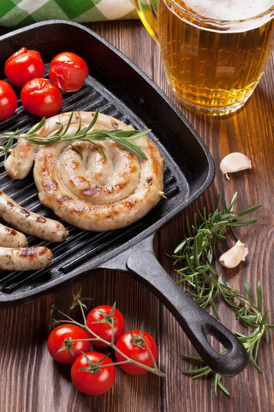 Beer mug and grilled sausages — Stock Photo, Image