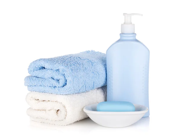 Shampoo bottle and soap with towels — Stock Photo, Image