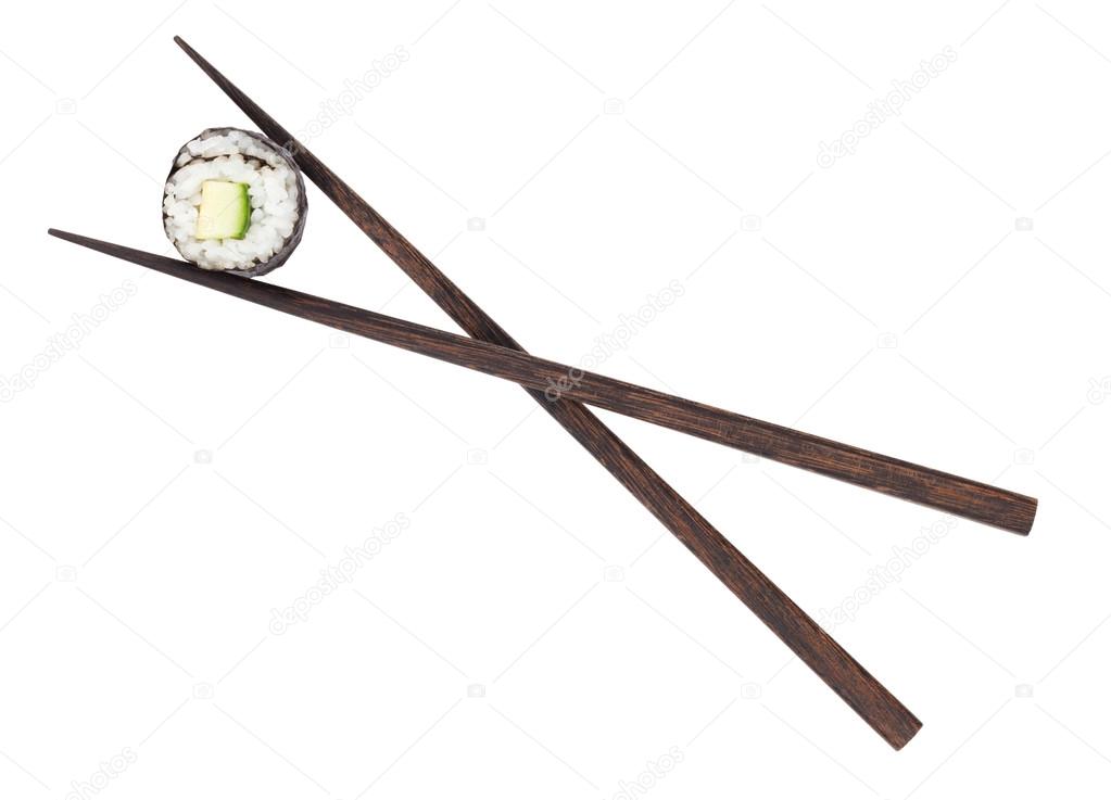 Sushi maki in chopsticks