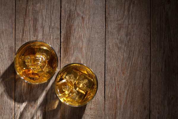 Glasses of whiskey with ice