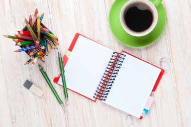 Office desk table with supplies and coffee