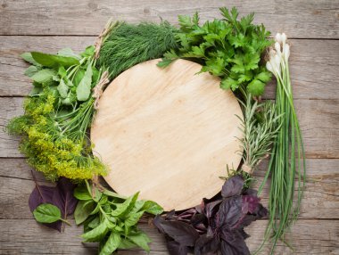 Fresh garden herbs and cutting board