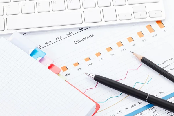 Office desk with reports, computer, supplies — Stock Photo, Image