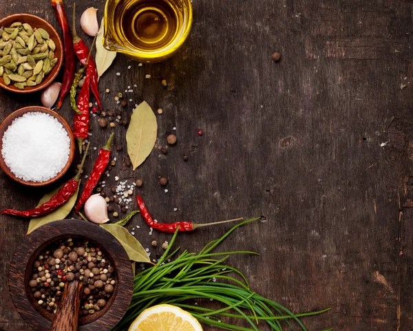 Various spices on wooden background