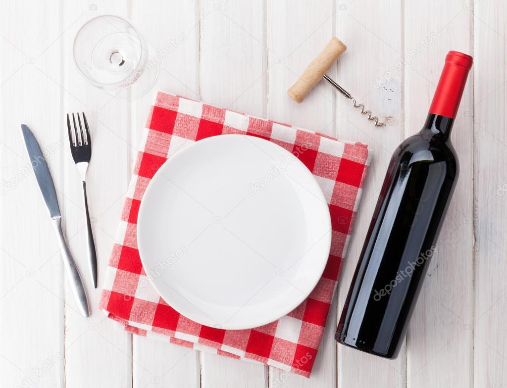 plate, wine glass and wine bottle