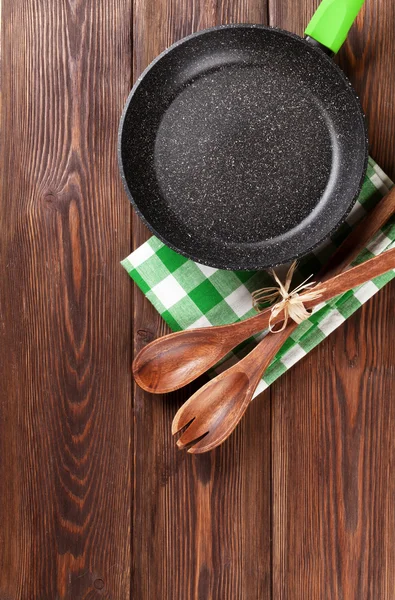 Cooking utensils on wooden table — Stock Photo, Image