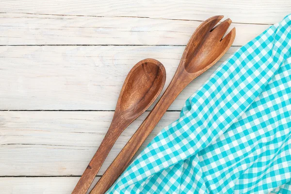 Kitchen utensils over white wooden table — Stock Photo, Image