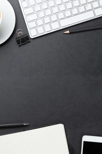 Office desk with computer, supplies and coffee — Stock Photo, Image