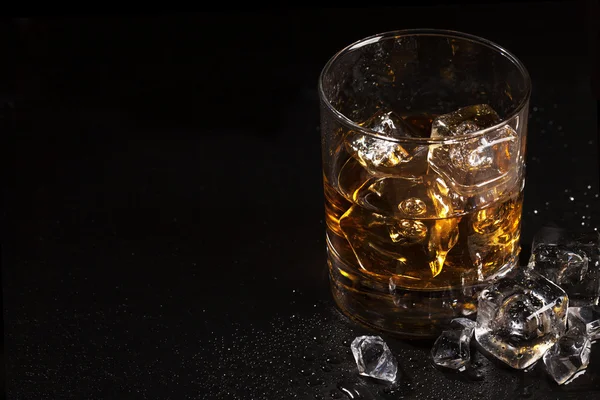 Glass of whiskey with ice — Stock Photo, Image