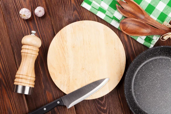 Cooking utensils on wooden table — Stock Photo, Image