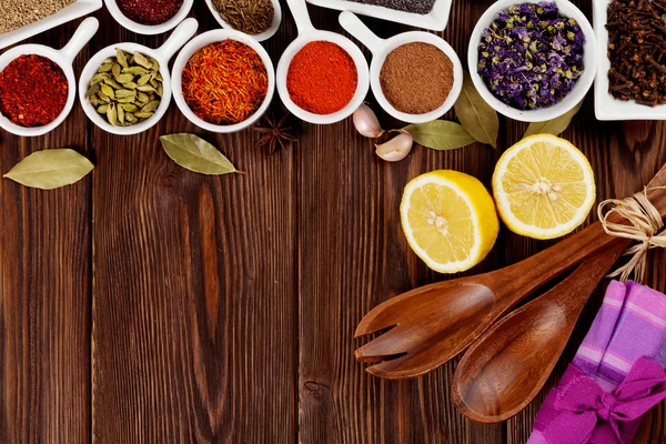 Various spices on wooden background — Stock Photo, Image