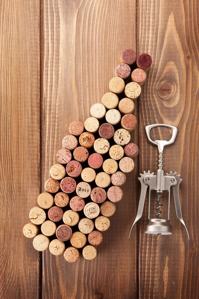 Wine bottle shaped corks and corkscrew — Stock Photo, Image