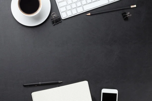 Desk with computer, supplies and coffee — Stock Photo, Image