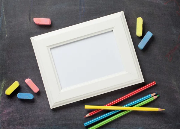 School supplies on blackboard background — Stock Photo, Image