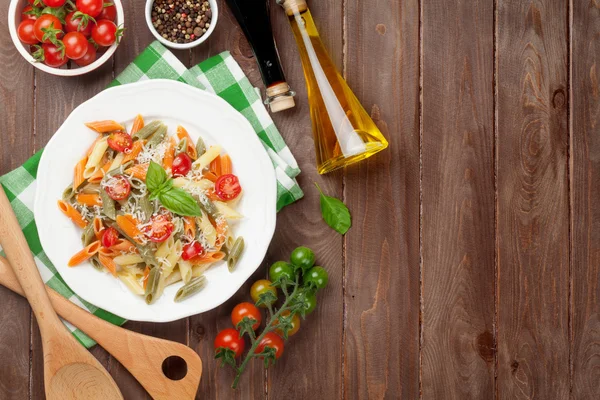 Colorful penne pasta with tomatoes — Stock Photo, Image