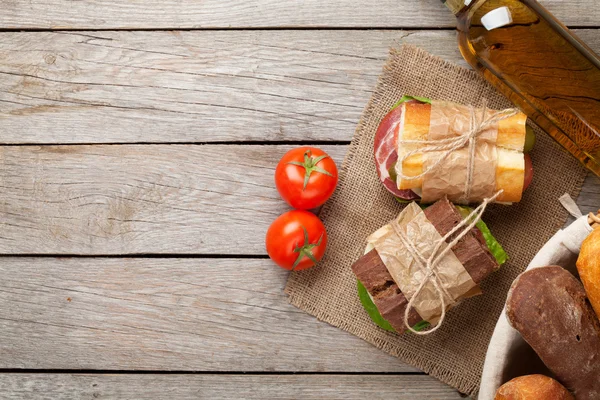 Two sandwiches and white wine — Stock Photo, Image