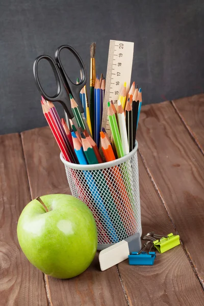 School and office supplies on classroom table — Stock Photo, Image