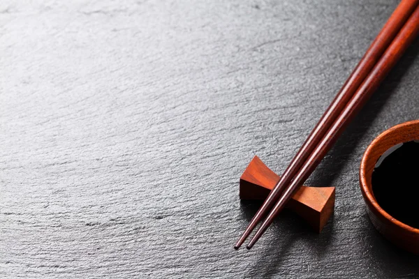 Japanese sushi chopsticks and soy sauce — Stock Photo, Image