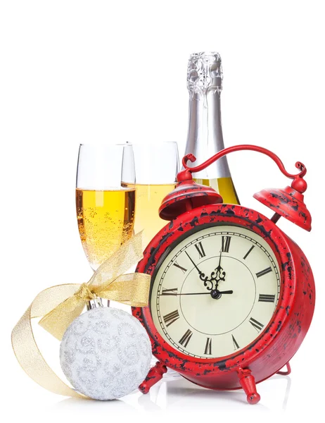 Champagne, christmas decor and alarm clock — Stock Photo, Image