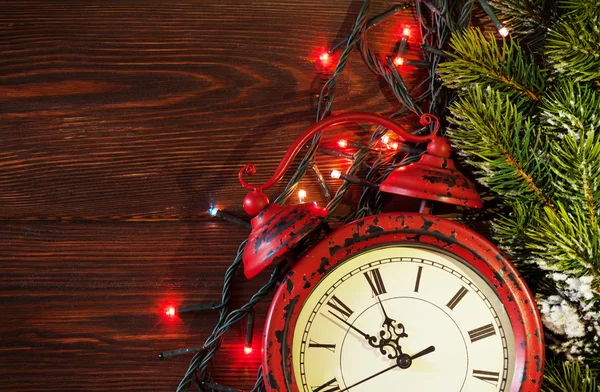 Christmas alarm clock, tree and lights — Stock Photo, Image