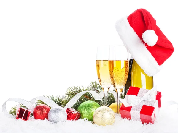 Champagne, christmas decor and santa hat Stock Photo