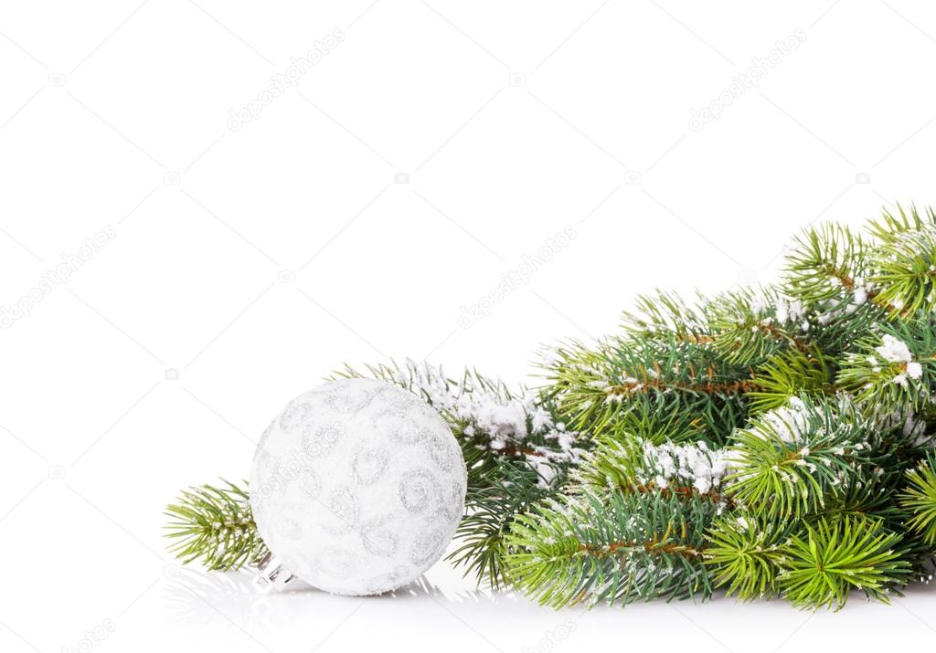 Christmas tree branch with snow and bauble