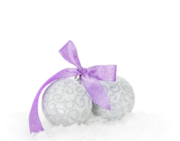 Christmas baubles and purple ribbon — Stock Photo, Image