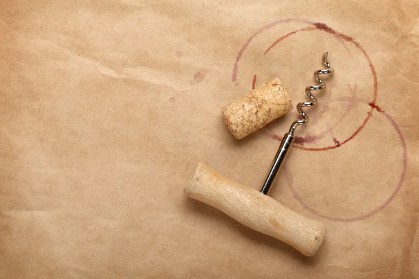 Cork and corkscrew with red wine stains — Stock Photo, Image