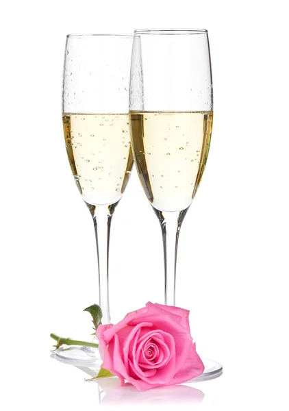 Two champagne glasses and pink rose — Stock Photo, Image