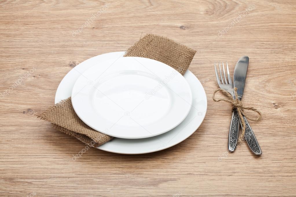 Empty plates and silverware set