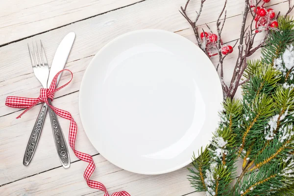 Empty plate and christmas tree