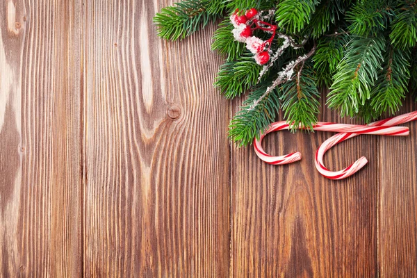 Candy cane and christmas tree — Stock Photo, Image