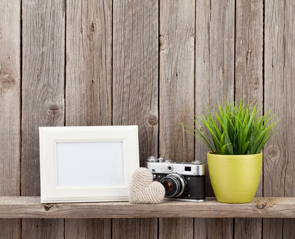 Blank photo frame, heart, camera and plant — Stock Photo, Image