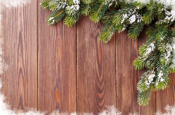 Kerstmis achtergrond met sneeuw fir tree — Stockfoto