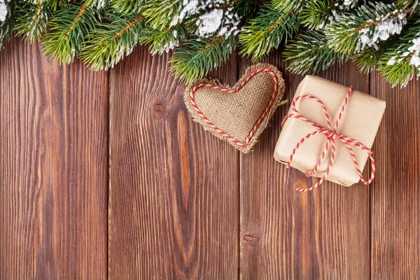 Christmas tree branch with gift box — Stock Photo, Image