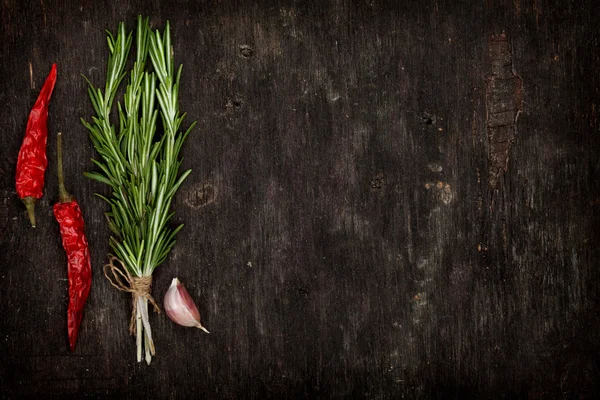 Herbs and spices on wooden table — Stock Photo, Image